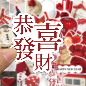 Hand holding red Happy New Year sticker featuring traditional Chinese greeting characters