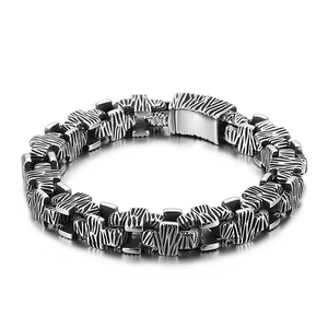 Men's hip hop stainless steel cross bracelet with textured black and silver links