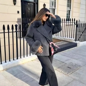 Elegant dark grey wool coat for women featuring a large fur collar and stylish cuffs