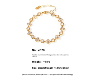 Detail of 18k gold plated stainless steel clover bracelet with zircons and lobster clasp