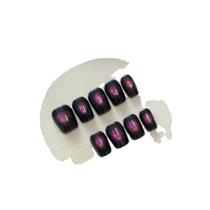 Handmade black and pink cat eye press-on nails with cosmic nebula galaxy effect