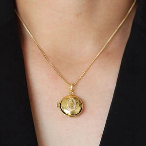 Gold round Virgin Mary locket pendant necklace with sparkling cubic zirconia crystals