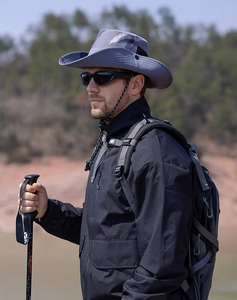 Close-up of blue-grey sun hat featuring breathable mesh vents and adjustable wind drawstring