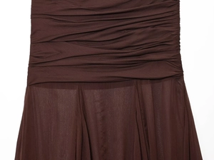 Detail of dark brown sheer chiffon fabric with pleated design and translucent hemline