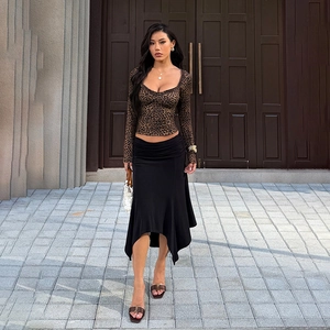 Slim fit leopard print long sleeve top with ruffle edges and black asymmetric skirt