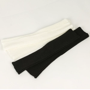 Detail showing ribbed knit texture of black and white winter leg warmers for girls