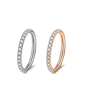 Close-up of G23 titanium hinged nose rings with clear zircon in silver and rose gold