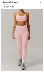 Close-up of peach pink quick-dry yoga set with thin straps and seamless high-waist leggings