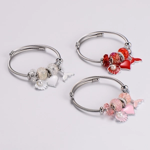 Adjustable stainless steel beaded bracelet with mermaid tail, heart, and shell charms
