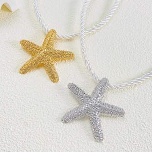 Starfish pendant necklace and stud earrings set with crystal inlay and gold finish