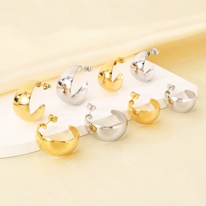 Polished C-shaped wide stainless steel earrings in gold and silver finish display