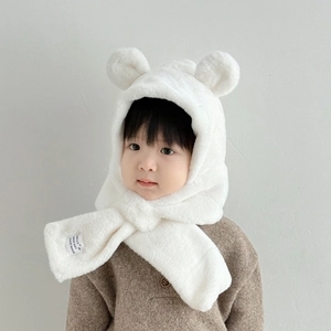 Detail of plush bear ear hat showing soft faux rabbit fur texture and secure cross loop