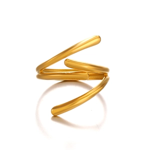 Minimalist spiral wrap stainless steel ring with golden polished finish on reflective surface