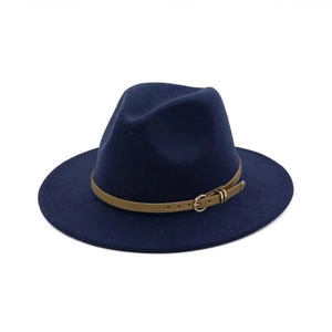 Detail of navy wool fedora hat featuring a brown leather band and gold metal buckle accent