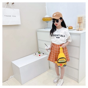 Kids outfit set featuring white Essentials t-shirt and cute yellow school bus crossbody bag