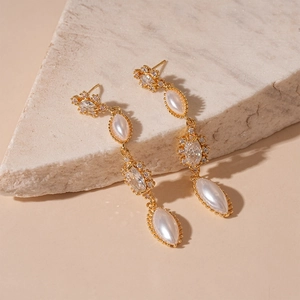 French vintage gold earrings with imitation pearls and zircon tassels on stone