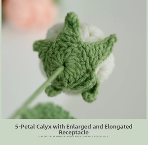 Macro detail of hand-knitted cream flower with 5-petal green calyx and long receptacle