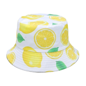 Summer sun bucket hat for women with vibrant lemon fruit print on white background