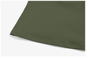 Detail view of the hem stitching on the olive green high-density knit yoga sports vest