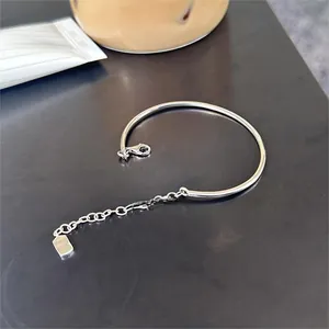 Detail of S925 silver minimalist geometric bracelet with lobster clasp and extension chain