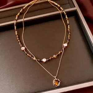 Collier double rang plaqué or 18 carats avec œil de tigre et perles baroques