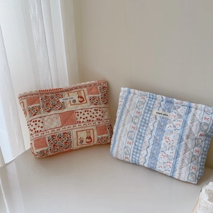 Quilted floral and striped cotton pouches with rabbits and simple wish label