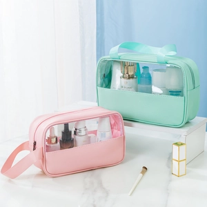 Detail of pink and mint green PU leather makeup bags with transparent PVC windows