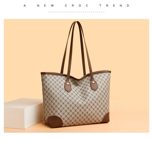 Macro detail of brown leather corners and geometric chain print on the large tote bag