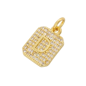 Detailed close-up of a luxury square gold pendant with pavé-set zircons in D-letter shape