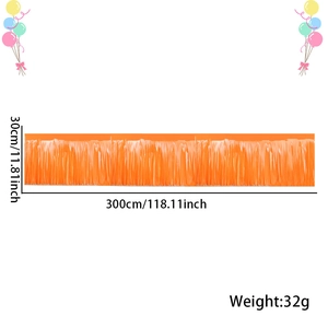 Detail view of orange fringe curtain banner for party decor measuring 300cm by 30cm