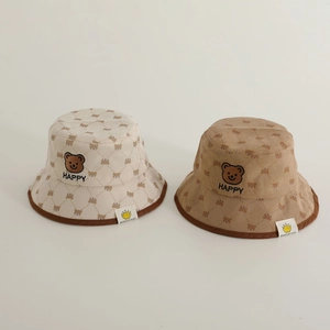 Set of two children's corduroy bucket hats with brown bear prints in beige and coffee brown