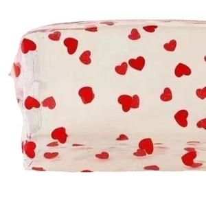Transparent PVC storage bag with cute red heart print and portable waterproof zipper closure