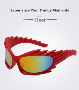 Macro shot of red flame-shaped sunglasses with Y2K style and colorful reflective lenses