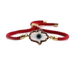Bracciale in corda rossa intrecciata con ciondolo mano di Fatima dorata e malocchio