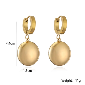 Detail of gold sphere earrings with 4.4cm length and 1.5cm diameter measurements
