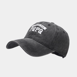 Detail view of the World's Best Papa lettering on a vintage black cotton baseball cap