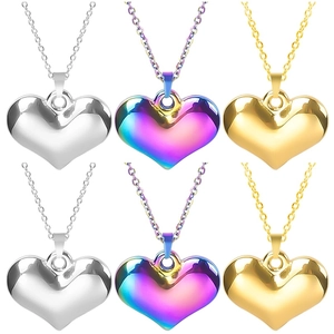 Polished stainless steel heart pendant necklace in silver, gold, and iridescent finishes