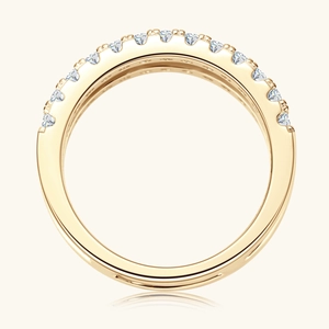 Macro shot of gold double-row moissanite ring with half-circle diamond inlay and reflections
