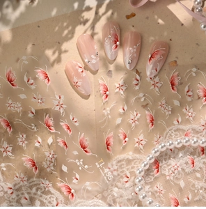 Detail showing self-adhesive nail art stickers with pink butterflies and white flowers