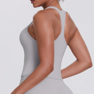 Close-up of the light gray racerback sports tank top with seamless high-stretch fabric