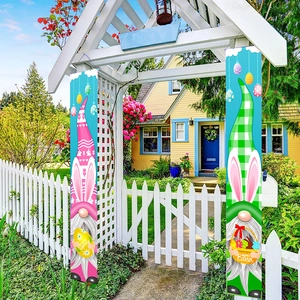 Outdoor Easter garden banners featuring gnomes and colorful eggs on white garden arches