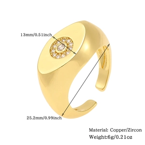 Detail view of adjustable gold ring featuring zircon inlay and precise dimensions