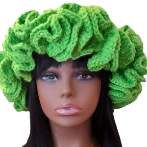 Green handmade crochet beanie with ruffled layered edges and textured knitted design