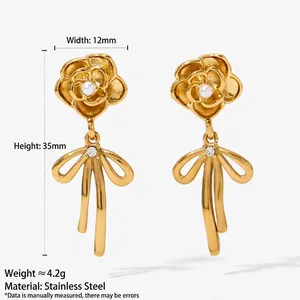 Boucles d'oreilles pendantes en acier 316L avec camélia, nœud papillon, perle et cristaux