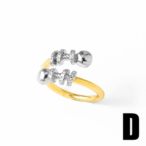 Detailed macro view of 18k gold plated spiral ring with silver beads and zircon pavé