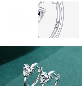 Macro shot of S925 sterling silver heart earrings with clear gemstone and hallmark