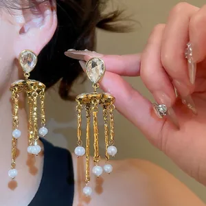 Elegant floral tassel pearl earrings with sparkling crystals and gold plated chains