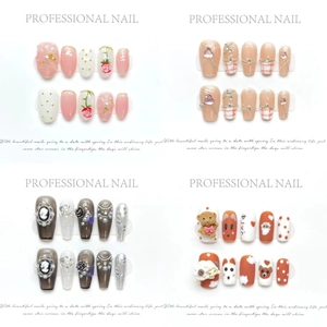 Artistic press-on nails set featuring floral, rhinestone, and cute animal patterns