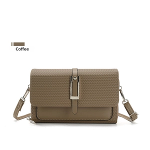 Detail of coffee brown PU leather bag with woven texture flap and silver buckle