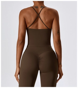 Detail of cross-back yoga vest and high waist leggings in dark brown athletic fabric